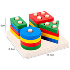 Four-column Montessori cylinder block set on a square birch base, 11.7 by 11.7 cm and 5 cm tall, with red, green, blue and yellow stacking pieces