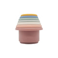 Silicone stacking cups nested into a single tower in a cool palette of dusty pink, grey, blue and cream