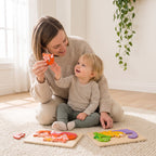 Parent naming animals with their toddler using the chunky wooden animal puzzles