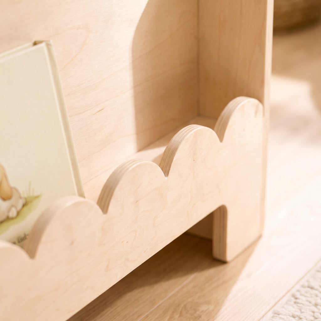 Macro of the scalloped front edge of the birch toddler bookshelf tier