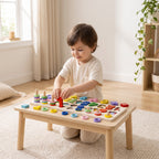 Child slotting a red wooden numeral into the matching board