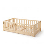 Montessori floor bed with rails and door, twin size oak, gate closed on the front left, shown on a white background